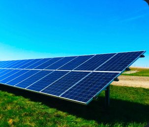 Solar panels in a green field